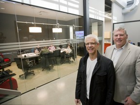 Slavko Prtenjaca, president of Creative Property Developments and Royal LePage owner Peter Meyer show off the new offices Friday in the second part of the London Roundhouse, on Horton Street. (Mike Hensen/The London Free Press)