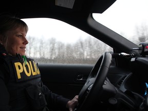 OPP Const. Juliane Porritt drives along Highway 401 on Friday. (Steph Crosier/The Whig-Standard/Postmedia Network)