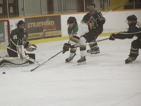 Huron East Centenaires forward, Brent Rae drives to the night in the first period of play against the Petrolia Squires. The opposing team prevailed. beating the Cents 5-2 last Saturday. (Shaun Gregory/Huron Expositor)