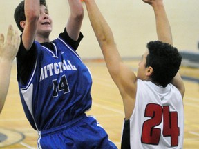 Karsen Eisler (14) of the Mitchell District High School (MDHS) junior boys basketball team scores two of his game-high 18 points in leading the Blue Devils to a 65-14 win over visiting South Huron last Wednesday, Jan. 17 in Huron-Perth conference regular season action. ANDY BADER/MITCHELL ADVOCATE