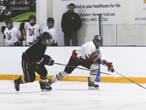 The Vulcan midgets Hawks played a home game against the Kainai Chiefs Friday but lost 4-1. In this photo: Jaxson Deitz manages to keep the puck away from the opposing team.