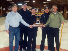 The John Young Jr. team won 33rd annual Farmers Bonspiel at the Sydenham Community Curling Club on Sunday, Jan. 21. Les Badder, left, from sponsor Waddick Fuels, presents the winning trophy to Young Jr., Jacques VanBilsen, John McColl and Pete Dekoning. The three-day event attracted 28 teams from across the province.