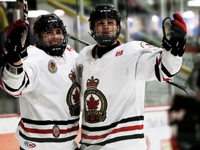Sarnia Legionnaires' Greg Hay, left, celebrates with Jon Sanderson after scoring in the first period against the Chatham Maroons at Chatham Memorial Arena in Chatham, Ont., on Sunday, Jan. 21, 2018. Mark Malone/Chatham Daily News/Postmedia Network