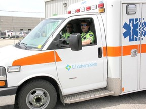 Medavie paramedics Mark Martin, in the driver's seat, and Steve Forbes are shown outside of Chatham-Kent EMS headquarters in this file photo. Chatham-Kent's chief of fire and emergency services has said adding an ambulance might ease pressures on the local EMS system, but ultimately won't fix it. (File photo)
