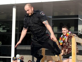 Const. Jason Herder was so pleased with the first Chatham-Kent Police Service Polar Plunge that he decided to jump into the frigid water twice on Saturday, at the St. Clair College HealthPlex in Chatham. (Ellwood Shreve/Postmedia Network)