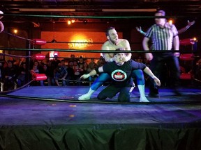 Sarnia city councilor Brian White participated in a Smash Wrestling match in Sarnia Friday. He's pictured taking a chair shot from Anthony Kingdom James just before White was pinned to end the match. (Submitted photo by Coun. Matt Mitro)