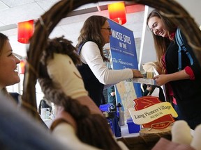 Co-ordinator Jill Chapman of Lang Pioneer Village, left, looks on as manager of waste Laurie Westaway chats with student Rachelle Law during Trent University's Career Centre's annual Summer Job Fair held at Gzowski College on Wednesday, Jan. 14, 2015. Clifford Skarstedt / Postmedia Network