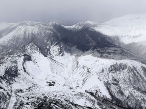 Ashes from Mount Kusatsu-Shirane cover near its summit after its eruption in Kusatsu, Gunma prefecture, central Japan, Tuesday, Jan. 23, 2018. Suo Takekuma / Kyodo News via AP
