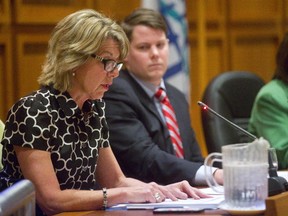 Matt Reid, the TVDSB chairperson listens as in Laura Elliott the TVDSB's Director of Education reverses their position and says they will fund the Grand Theatre's production of Prom Queen. (MIKE HENSEN, The London Free Press)