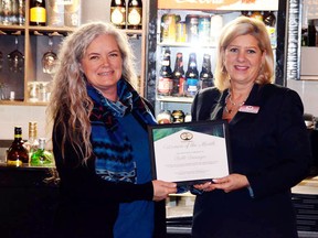 Marianne Matichuk, right, president of Greater Sudbury BPW, makes a presentation to Bobbi Deisinger, owner of All About Massage Day Spa. Supplied photo