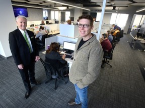 HRdownloads chief executive and founder Tony Boyle, right, and general manager Brian O?Leary show off the firm?s big new eighth-floor digs at 195 Dufferin Ave. in London. HRdownloads supports human resource departments with software platforms. (MORRIS LAMONT, The London Free Press)