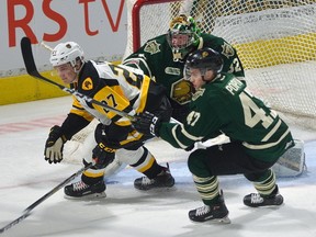 Hamilton Bulldogs' Robert Thomas (a former London Knight) is held in check by Knights forward Sergey Popov in front of goaltender Joseph Raaymakers during the first period of an OHL game at Budweiser Gardens in London, Ontario on Friday Jan 12, 2018. (MORRIS LAMONT, The London Free Press)