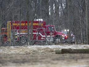 Malahide Fire Services attend a woodlot on Pede Road south of Nova Scotia Line in Malahide Township on Wednesday where a man was killed when a tree he was cutting fell on him. (DEREK RUTTAN, The London Free Press)