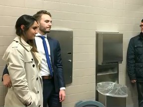 In this screenshot, Maria Schulz and Brian Shulz get married in a courthouse bathroom. Monmouth County Sheriff's Office/Facebook