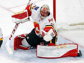 Calgary Flames goaltender Mike Smith (41) eyes the puck during the third period of NHL action against the Carolina Hurricanes in Raleigh, N.C. Smith has been named to the NHL All-Star game as a replacement for the injured Jonathan Quick of the Los Angeles Kings. (Karl B. DeBlaker/The Associated Press)