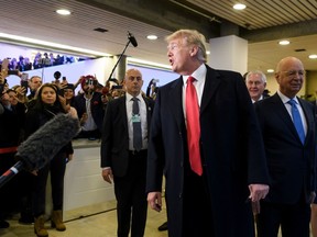 US President Donald Trump arrives next to Founder and Executive Chairman of the World Economic Forum (WEF) Klaus Schwab (R) to address the World Economic Forum (WEF) annual meeting on January 26, 2018 in Davos, eastern Switzerland. FABRICE COFFRINI/AFP/Getty Images