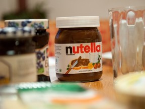 A picture taken on January 8, 2014 shows a pot of Italian hazelnut and cocoa spread "Nutella" on a breakfast table in Inzell, Germany. TOBIAS HASE/AFP/Getty Images