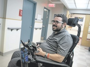 Aymen Derbali, 41, a victim of the Quebec City mosque attack, chats following exercises this week in Quebec City at a rehabilitation centre whre he has lived since July. Derbali was inside the prayer room of a Quebec City mosque when the shooter entered and fired on worshippers on Jan. 29, 2017. He tried to stop the assailant before taking seven bullets, one of which reached his spinal cord. Today he is paraplegic. (ALICE CHICHE/AFP/Getty Images)