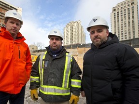 Tricar?s construction director, Chris Leigh, left, site supervisor Olimpio Couto and vice-president Adam Carapella are seen at their newest construction project at 40 York St. in London. The 24-floor residential tower will overlook Ivey Park and the forks of the Thames. (MIKE HENSEN, The London Free Press)