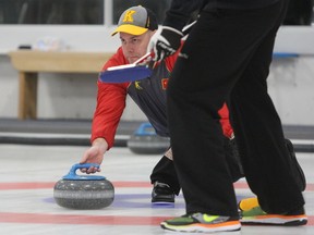 Skip Jon Beuk gets ready to release a shot during a semifinal match at the 85th annual Whig-Standard men's bonspiel at the Royal Kingston Curling Club in Kingston on Saturday, Jan. 27, 2018. Beuk, of the Cataraqui Golf and Country Club, defeated Joe Waller 10-4 in the final to capture the title. Steph Crosier/The Whig-Standard/Postmedia Network