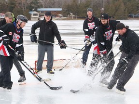 BRUCE BELL/THE INTELLIGENCER
With mild temperatures hitting the region over the weekend, water was flying at Oak Lake during the 6th Annual Kerr Pond Hockey Tournament. Nine teams gathered to raise funds for the Stirling Splash Pad project.