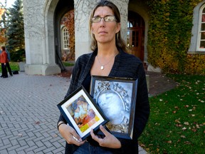 Marcia Patterson holds photos of her brother, Keith Patterson, who died after hanging himself in Elgin Middlesex Detention Centre in September 2014. (File photo)