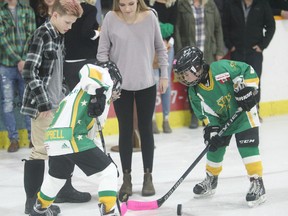 The community packed the Seaforth Arena Jan. 27 for the Seaforth Stars Dedication Night, an event honouring Tanner Steffler and Rebecca Kipfer-Pryce with a special three-on-three game between all ages. The two died last year, they were former hockey players of the Stars, and so a special unveiling of their jerseys was the main attraction. Here is the puck drop before the game. (Shaun Gregory/Huron Expositor)