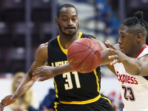 Shaquille Keith of the Windsor Express chases a loose ball against London Lightning?s Kirk Williams Jr. in National Basketball League of Canada action at WFCU Centre Sunday in Windsor. The Express won 107-96. (NICK BRANCACCIO/Windsor Star)