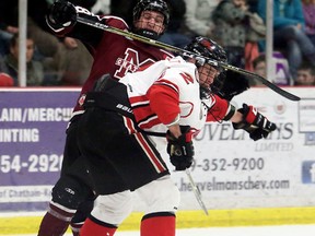 Leamington Flyers' Levi Tetrault (2) hits Chatham Maroons' Jordan Frasca (88) in the third period at Chatham Memorial Arena in Chatham, Ont., on Sunday, Jan. 28, 2018. (MARK MALONE/Chatham Daily News/Postmedia Network)