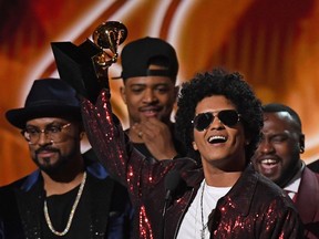 Bruno Mars receives his third Grammy for Album of the Year during the 60th Annual Grammy Awards show on January 28, 2018, in New York. (AFP PHOTO)