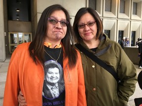 Nicole Ireland and Tanis Doxtator pause outside the London courthouse after Brennan Nicholas was sentenced Monday to life behind bars with no chance at parole for 13 years in the 2014 killing of their father Carson Ireland. (JANE SIMS, The London Free Press)