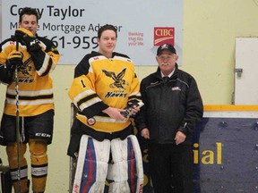 Exeter Hawks goaltender Dane Gubbels accepts the November Yeck Division Player of the Month from Provincial Junior Hockey League convener Wayne Smith before the Hawks game on Jan. 19 against the Port Stanley Sailors. (Terry Heffernan/Exeter Lakeshore Times-Advance)