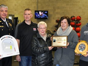 An automated external defibrillator (AED) was donated to Live Well 4 Life in Mitchell last Wednesday, Jan. 24 in memory of former West Perth fire Chief Bill Elliott. On hand for the presentation was West Perth fire Chief Bill Hunter (left), Patrick Armstrong of the Dave Mounsey Memorial Fund, widow Norma Elliott, daughter Kristi Beuermann and AJ Moses, co-owner of Live Well. ANDY BADER/MITCHELL ADVOCATE
