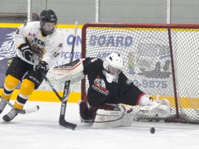 Connor MacLean (12) of the Mitchell Bantams sniffs around the Listowel net and goalie Myles Novotony for a rebound during action from Game 2 of their OMHA ‘B’ playoff series last Wednesday, Jan. 24. The locals won 4-1. ANDY BADER/MITCHELL ADVOCATE