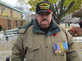 Sarnia's Arnold LePotvin is shown wearing medals while waiting on Christina Street for the Remembrance Day parade in November. LePotvin handed over his medals after questions were raised about his claim of having served in the U.S. military during the Vietnam War. (File photo/Sarnia Observer/Postmedia Network)