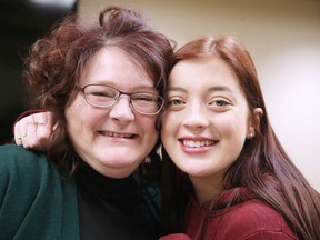 Sudbury transit operator Christine Larochelle embraces Val Therese teenager Hannah Godin on Monday. Larochelle saved Godin's life last month by performing life-saving CPR after the teen suffered a heart attack on the side of Municipal Road 80. (Gino Donato/Sudbury Star)