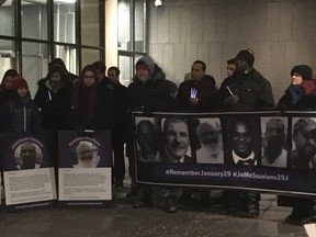 Dozens of mourners gathered in the cold outside city hall on Monday night during a memorial for the six lives lost and the nineteen worshippers injured after a gunman opened fire in a Quebec City mosque on Jan. 29, 2017. (MEGAN STACEY, The London Free Press)