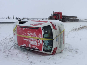 This van was involved in one of three crashes Tuesday within a few kilometres on Highway 402 just west of Centre Street, north of Strathroy. A heavy streamer made the road icy and decreased visibility. The van rolled over in the median, a semi ended upright in the ditch and a small SUV spun into the ditch. (MIKE HENSEN, The London Free Press)