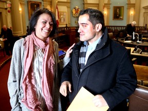 Owners of the Plaza Gentlemen's Club Belinda Satos and her son, Alex Dritsas, chat after the City of Kingston Appeals Committee reinstated their business licence at City Hall on Tuesday. (Ian MacAlpine/The Whig-Standard)