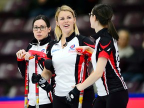 Team Ontario third Stephanie LeDrew, left, of Sarnia, lead Karen Sagle and second Cheryl Kreviazuk take on P.E.I. at the Scotties Tournament of Hearts in Penticton, B.C., on Monday, Jan. 29, 2018. (SEAN KILPATRICK/The Canadian Press)