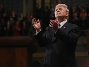 US President Donald Trump claps during the State of the Union address in the chamber of the US House of Representatives in Washington, DC, on January 30, 2018. (Win McNamee/AFP photo/Getty Images)
