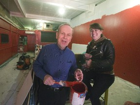 David Chapman and his daughter, Natalie Chapman, show off the signature red paint going on the walls of the renovated David?s Bistro Wednesday. The pair say the restaurant is to reopen Feb. 12 after being closed seven months for renovations. (Derek Ruttan/The London Free Press)