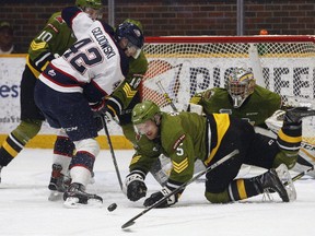 North Bay Battalion defenceman Jesse Saban (5) sweeps the puck away after making one of several blocks during a five-on-three penalty kill during the second period of OHL play against the Saginaw Spirit at Memorial Gardens on Sunday, Jan. 21, 2018. (Dave Dale / The Nugget)