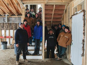 Julia McKay/The Whig-Standard
Students in the Building Construction Internship Program are seen during the open house at 224 Pratt Dr. in Amherstview on Wednesday to show off all of the work they completed in the house since September. Teacher Dan Fisher, centre, said this is the 91st house that students have built through the Focus program.