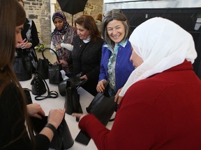 Kingston and the Islands MPP Sophie Kiwala talks with participants of Kingston Employment Youth Services’ Begin Again Group during a funding announcement on Thursday. (Elliot Ferguson/The Whig-Standard)