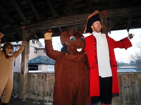 Millpond Moe celebrates his lack of shadow with town crier The Real Timmy Boyle and Lions Club mascot Larry the Lion on the covered bridge in Stirling this morning.