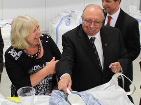 London MPP Deb Matthews reacts after Sarnia-Lambton MPP Bob Bailey tries some of BioAmber's succinic acid during an official opening held in the summer of 2015 at the company's Sarnia plant. The company said a recent study showed strong results using its succinic acid as an ingredient in animal feed. File photo/Sarnia Observer/Postmedia Network