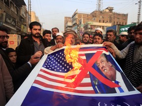 Muhammad Sajjad/The Associated Press
Pakistani traders protest against U.S. President Donald Trump in Peshawar, Pakistan, on Jan. 5. A senior Pakistani senator has expressed disappointment at the U.S. decision to suspend military aid to Islamabad, saying it will be detrimental to Pakistani-U.S. relations. Nuzhat Sadiq, the chairwoman of the Senate Foreign Affairs committee in the upper house of parliament, says Islamabad can manage without the United States as it did in the 1990s, but would prefer to move the troubled relationship forward.