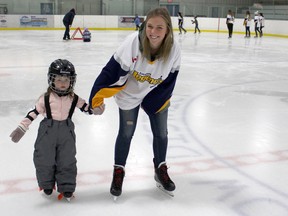 Women's Hockey Day in Lucknow brought out some 'Legends' to skate with the public at the Lucknow Arena on Saturday Jan. 27, 2018. Pictured: Olivia Simpson did some laps with her favourite hockey player Laura Jacobsen of the Lucknow Legends Senior B Girls Hockey Team. (Ryan Berry/ Kincardine News and Lucknow Sentinel)