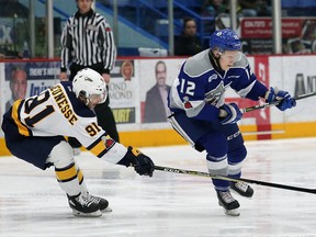 Alexey Lipanov, right, of the Sudbury Wolves, manoeuvres around Troy Lajeunesse, of the Erie Otters, during OHL action at the Sudbury Community Arena in Sudbury, Ont. on Friday, February 2, 2018. John Lappa/Sudbury Star/Postmedia Network
